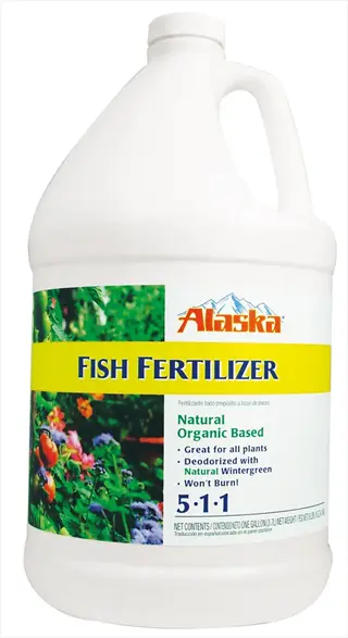 alaska fish fertilizer gallon jug with colorful floral background and text highlighting natural organic formula (5-1-1 npk)
