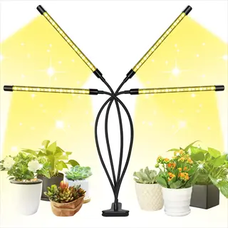 multi-arm clamp grow light illuminating seedlings and potted plants in an indoor garden setup